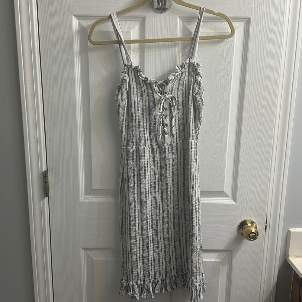 Blue and cream stripped dress with lace up detail.